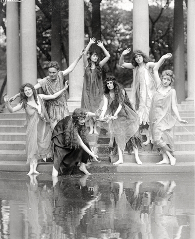 Group of six young ladies and a man dancing on steps in some sort of production, Brookline, MA