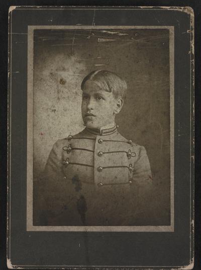 Unknown young man in military dress
