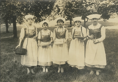Five women in costumes
