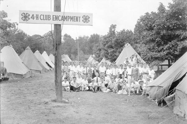 4 - H Club encampment, young men with tents