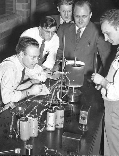 Students looking at centrifuge