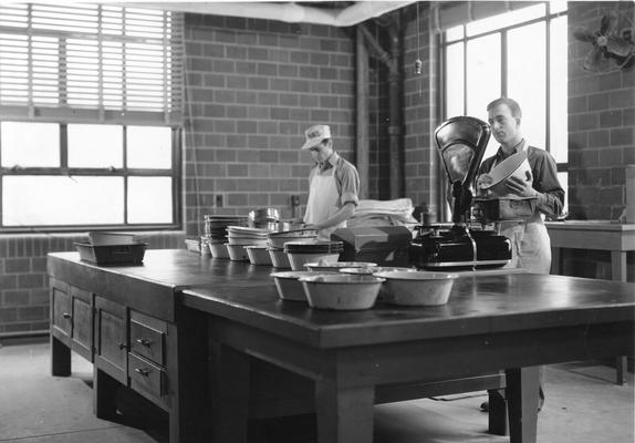 Students with dairy processing equipment