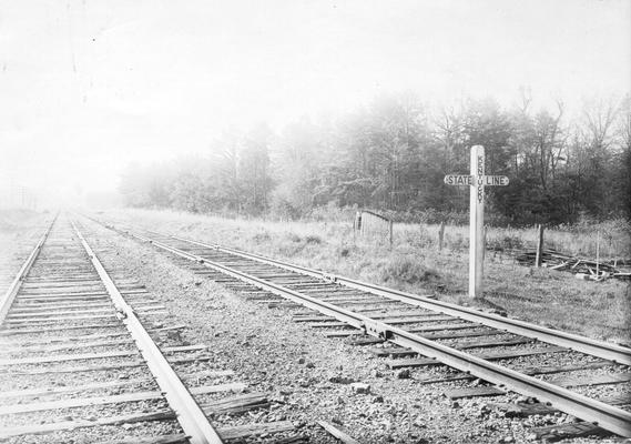 Two parallel tracks and Kentucky State line marker