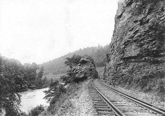 View of Railroad between rock ledges and stream