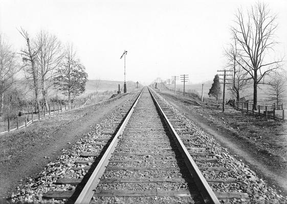 Railroad tracks with fence rows along each side, March 3, 1910