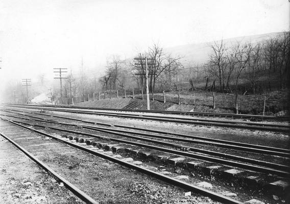 Railroad tracks near hill