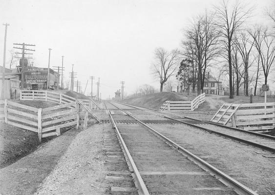 Railroad tracks, barns and houses