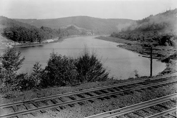 Railroad tracks, east across body of water