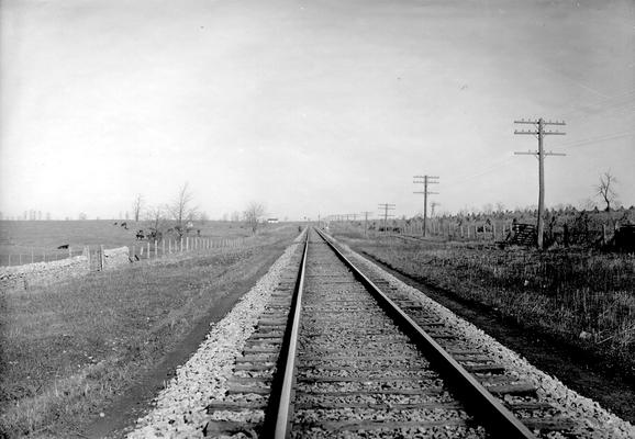 Railroad tracks passing through farmland