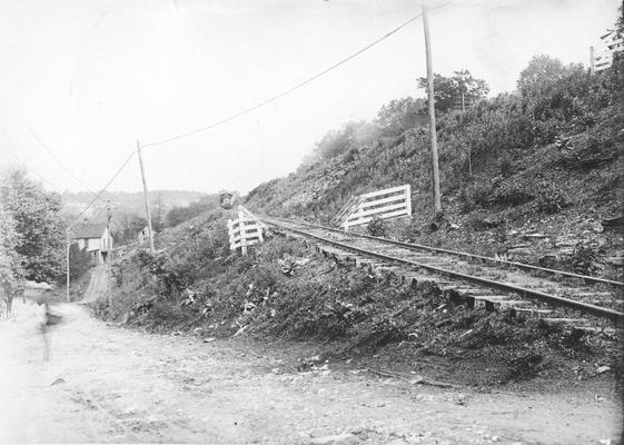 Train approaching a hill