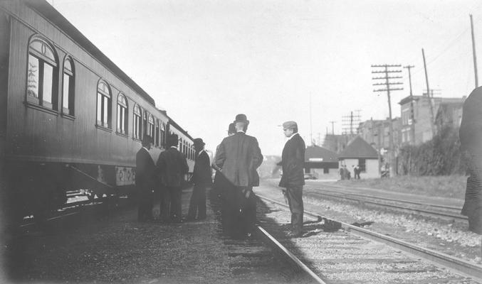 Passenger car on train tracks