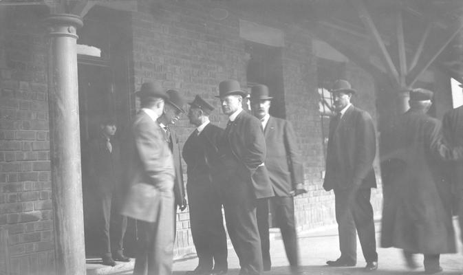 Group of men standing at station