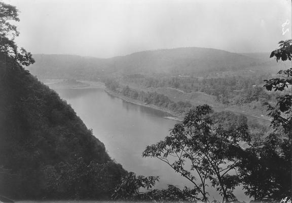 River with railroad tracks in distance