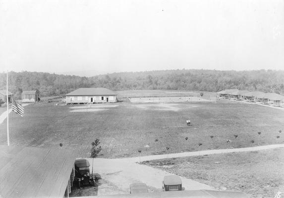 Cabins or barracks with United States flag at half-mast