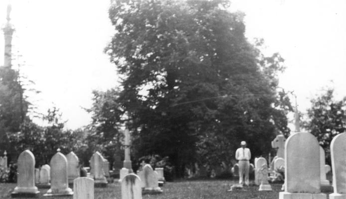 Unidentified individual in cemetery, print donated by Mr. John C. Taylor