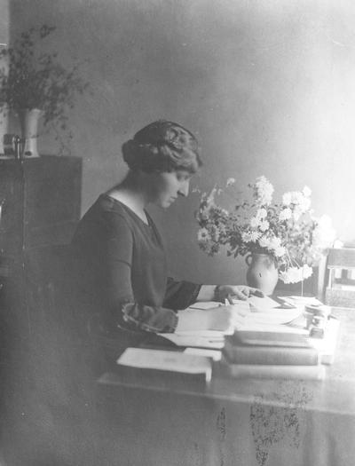 McVey, Frances Jewell, Instructor of English, 1917 - 1923, Dean of Women, 1921 - 1923, profile, working at desk