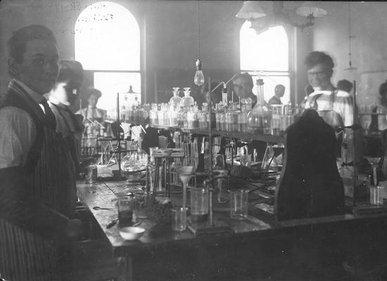 Men and Women students in chemistry class