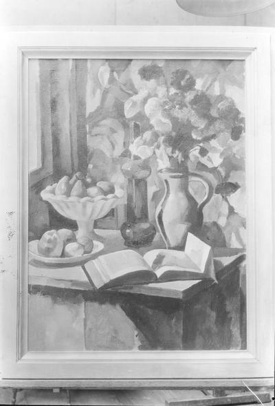 Table with flowers, fruit, and a book
