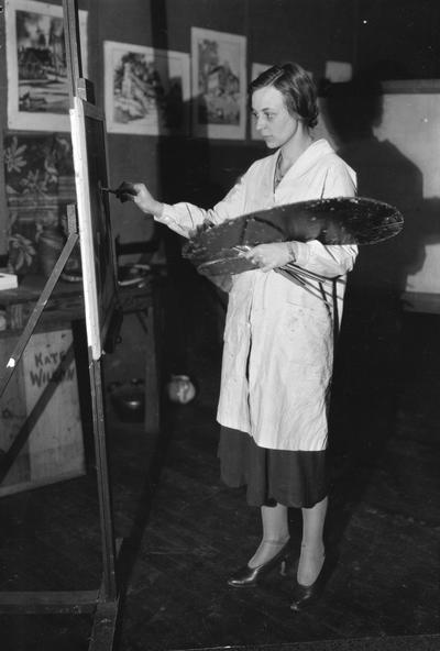 Woman artist painting, possibly Joy Pride, circa 1930