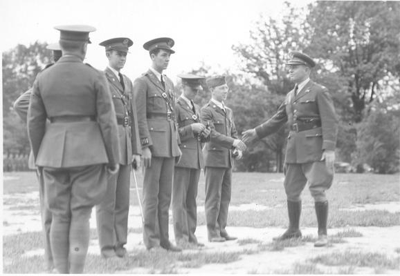 Award Ceremony, Warrant Officer George A. Knight congratulating the Reserve Officer Training Corps rifle team, duplicate