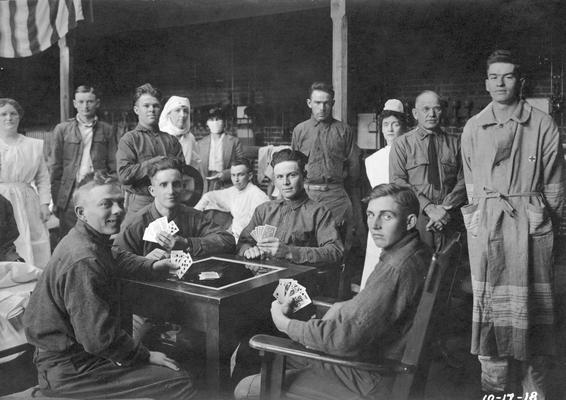 Convalescents playing cards in Gymnasium Hospital / Buell Armory during influenza epidemic, October 17, 1918