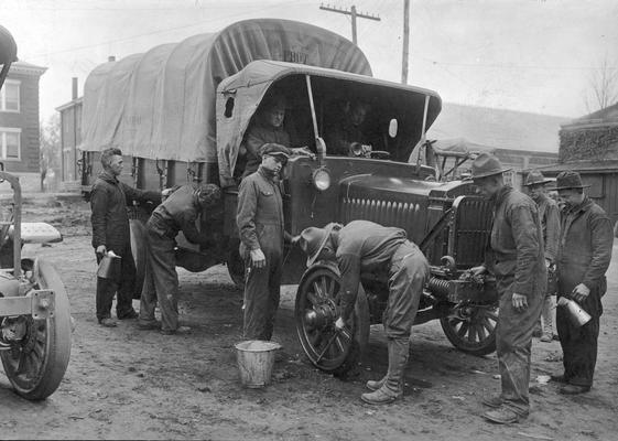 Soldiers and truck maintenance on bivouac, 1918