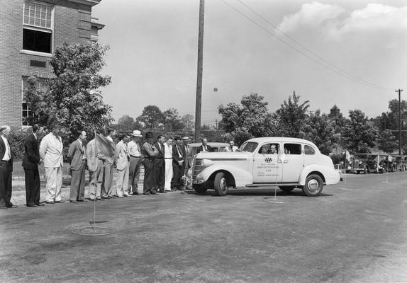 Man demonstrating the training car in Driver Education class, duplicate