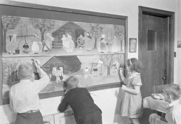 Students in art class, painting a frontier scene, November 4, 1932