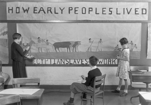 Students in art class, painting an Egyptian scene, November 4, 1932