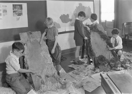 Students working with animal hides, duplicate