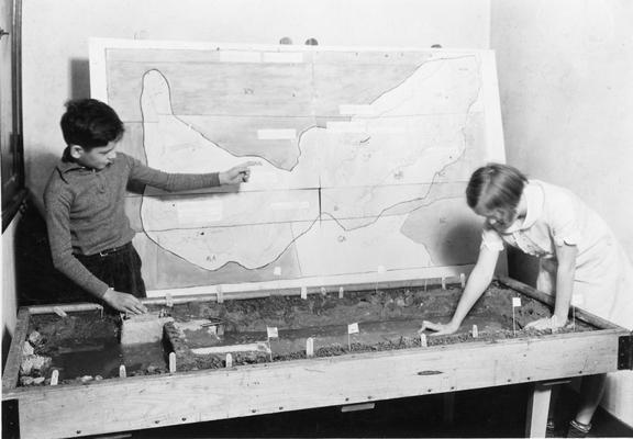 Students with model of a Panama canal