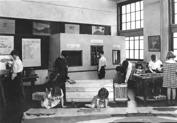Students building a model of a post office