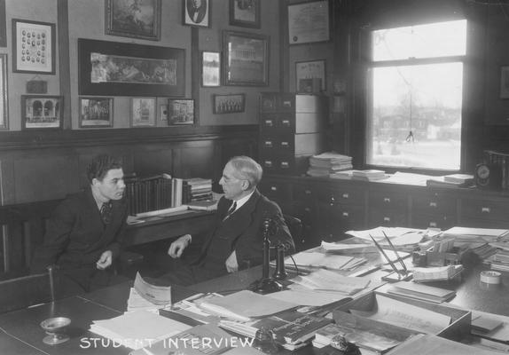 W.E. Freeman, Engineering, and a young man during a student interview, duplicate