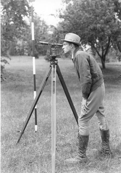 Young man surveying