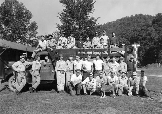 Surveying class by the truck, labeled College of Engineering, University of Kentucky, Lexington, KY