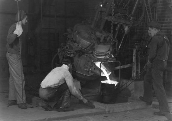 Woman and men students in Forge Shop