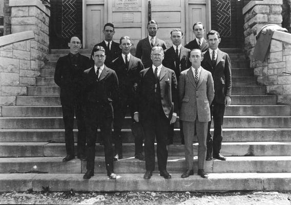Men law students and a professor, 1922-1923, in front of Lafferty Hall, law school