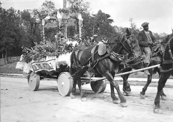 Golden Jubliee Parade, cart float and African American man riding a mule, 1916