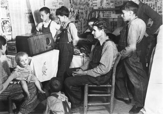 Family listening to the radio