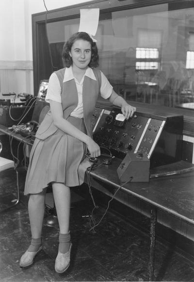 Woman with radio station equipment