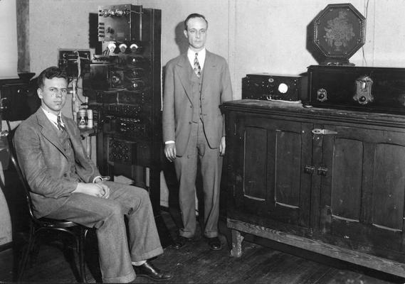 Unidentified men and equipment at radio station