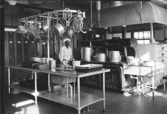 African-American chef in cafeteria kitchen