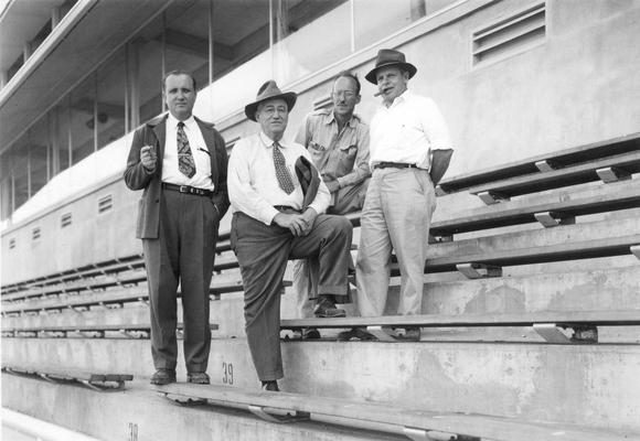 Dean Daniel V. Terrell, engineering with unidentified individuals inside McLean Stadium