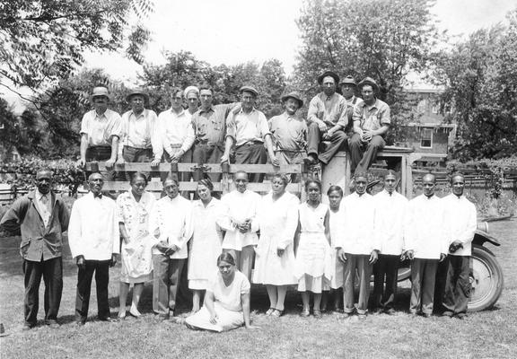 Senior Breakfast Alumni Tea, African American servers in first row and yard workers on truck