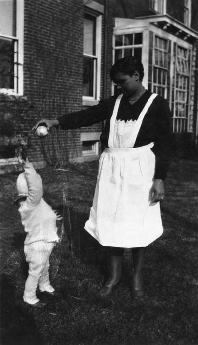 Maxwell Place visitors, African American nanny playing with a McVey child