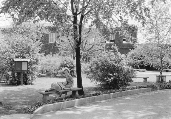 Two young women on a bench