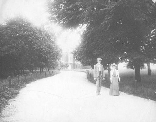 Woman and man walking on campus