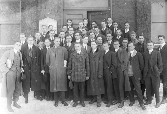 Group of men standing in front of Mechanical Hall