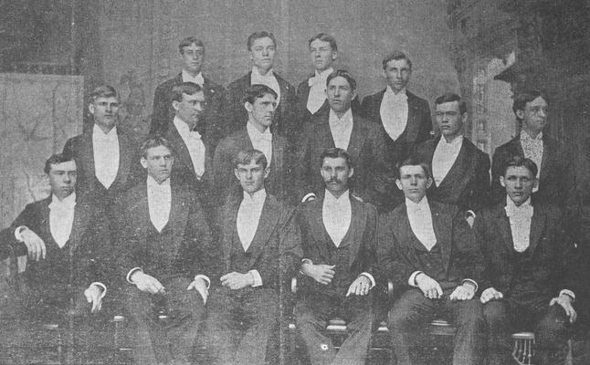 Fraternity men in formal attire, Row 1, Thomas Roland Dean, Houston, John W. Willmott, Madison Boyd Jones, Hilary Roberts, John W.Woods, Row 2, R. Taylor Lyle, Henry C. Anderson, John Bryan, J. J. Lyle, J. R. Johnson, Reed Faris, Row 3, Thomas H. Shelby, G. F. Blessin, Harry Beardsly, Billy Powell