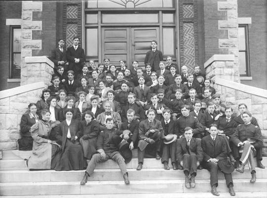 Co-educational group on steps, circa 1900